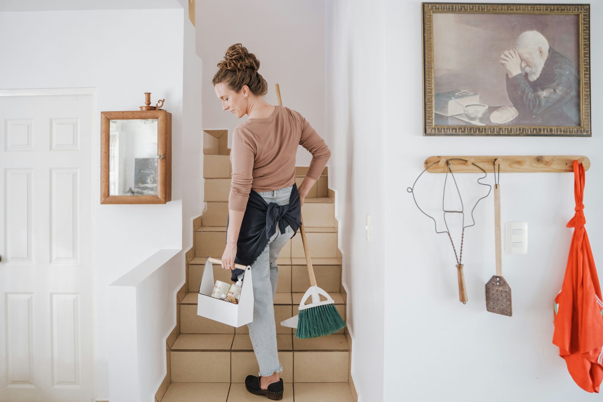 Cleaner wiping down a kitchen surface