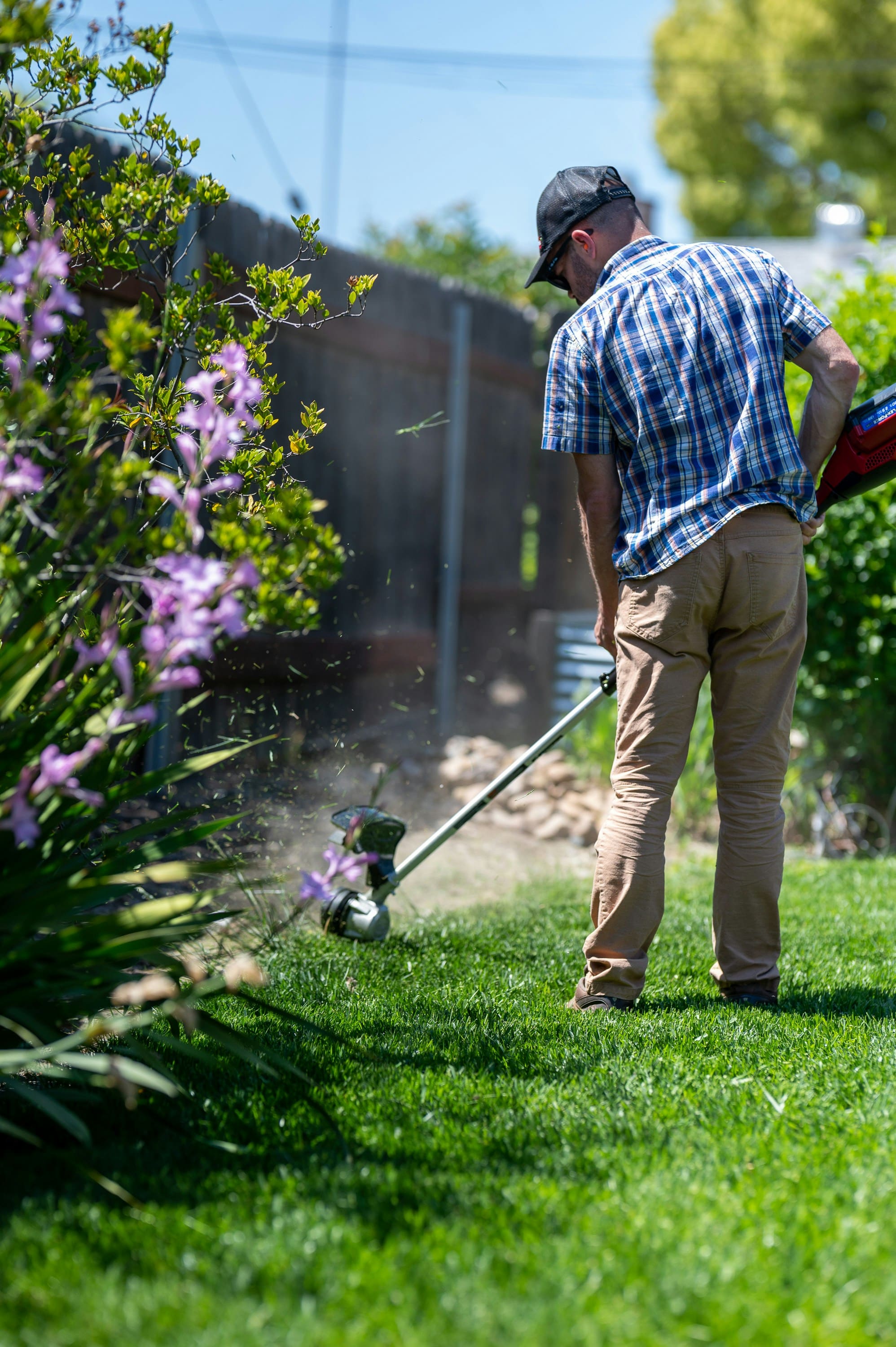 Gardener mowing a lawn